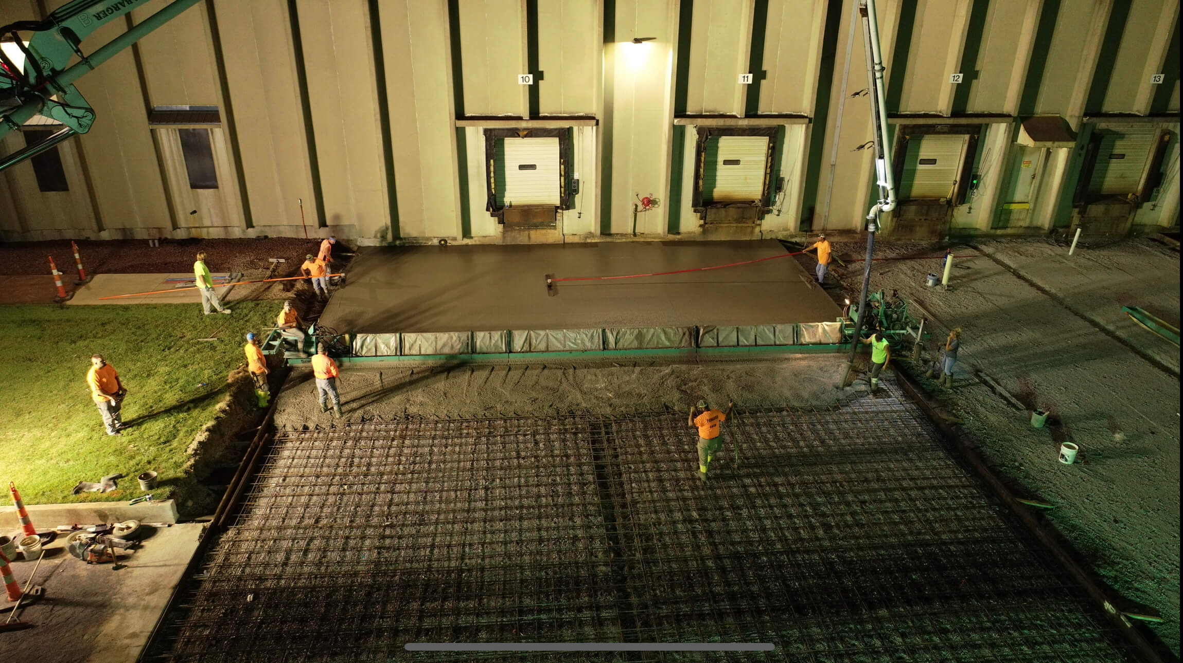 Men pouring concrete in Verdesian